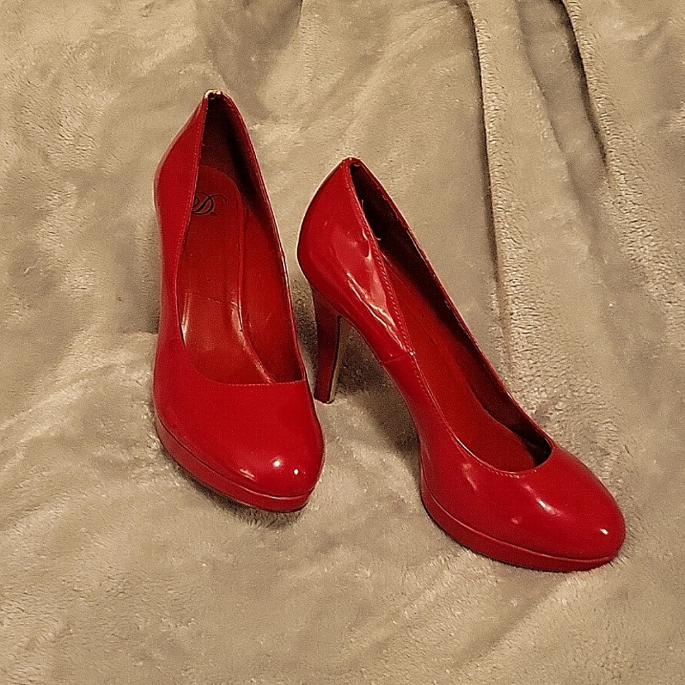 Size 9 lSexy Red high heels by D surprisingly comfortable. Worn just once.